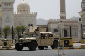 A military vehicle is stationed outside the al-Saleh mosque in Sanaa